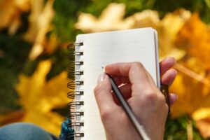 hand-writing-checklist-on-notepad