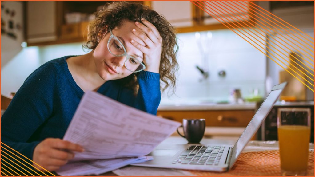 A women looking at a high energy bill.
