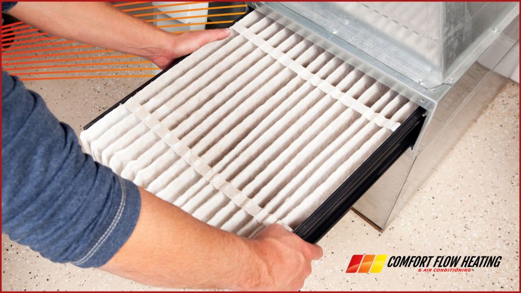 A homeowner changing an air filter in his home.